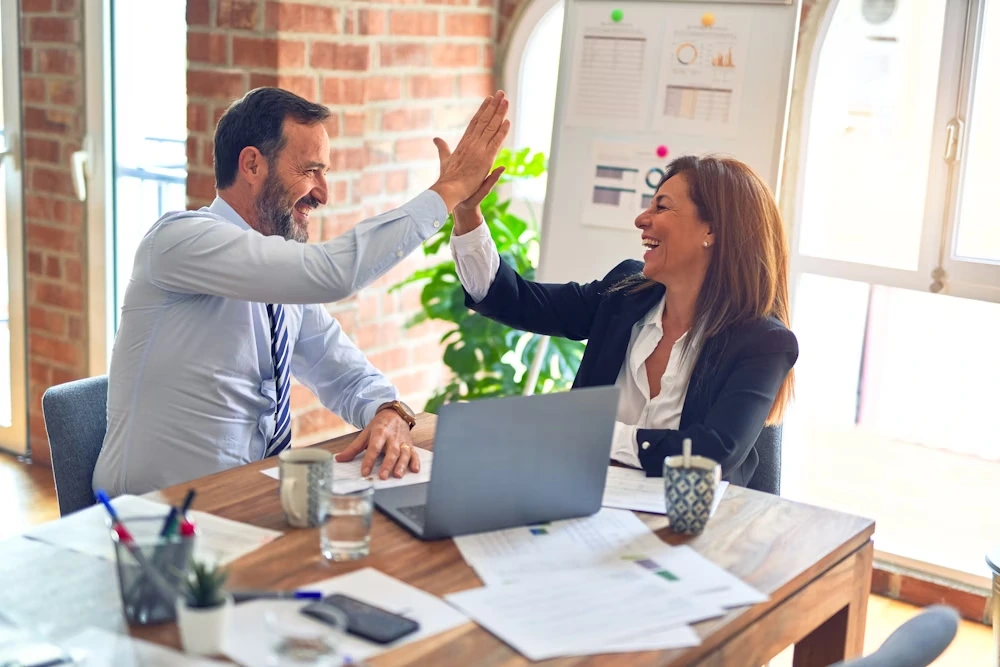 Attorney's high-fiving each other